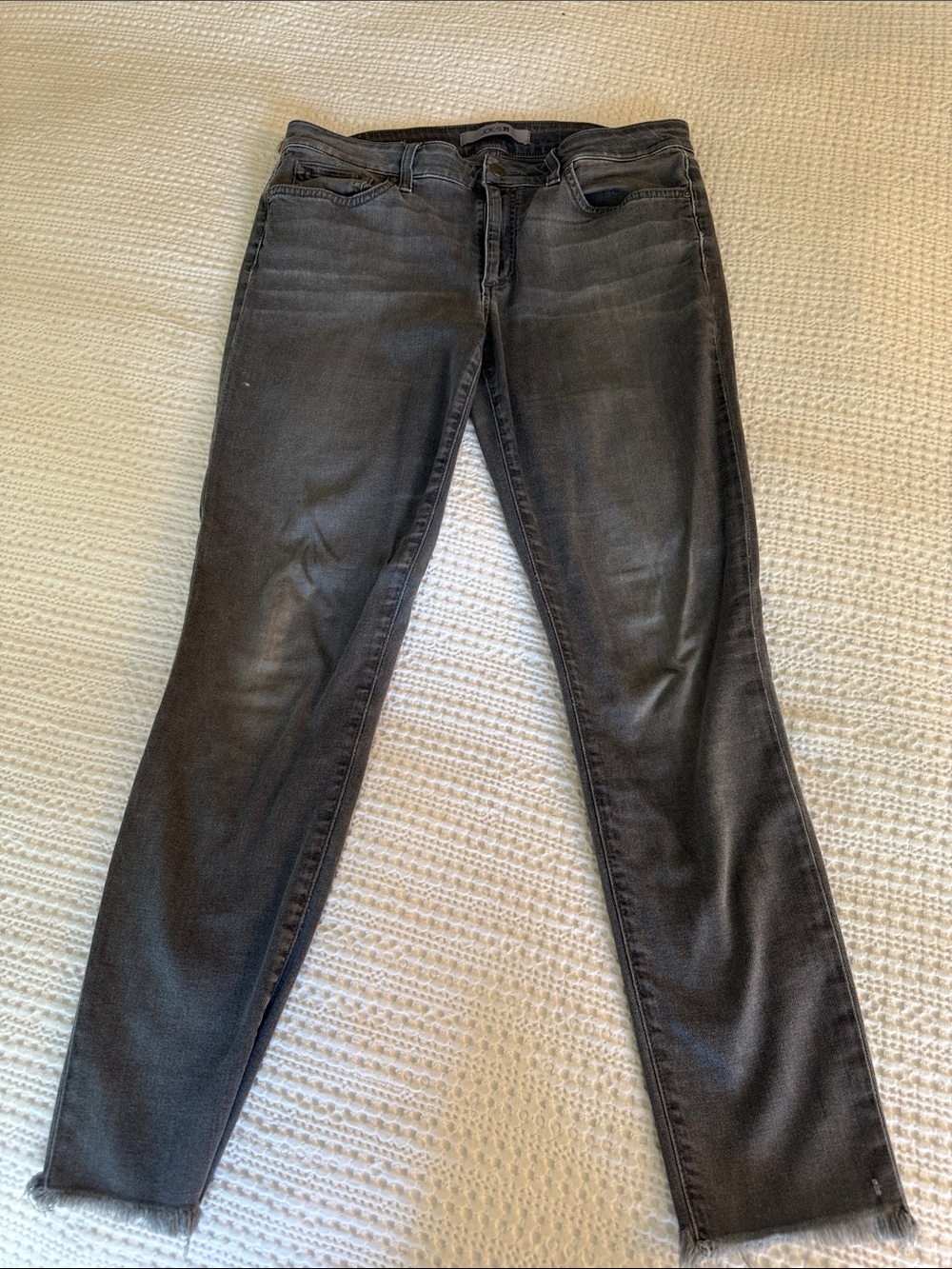 Joe's Jeans Black Skinny Jeans with Subtle Fade and small fringe on ankle